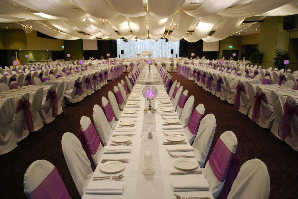 Marquee ceiling canopy white silks, purple bows long tables - Cex