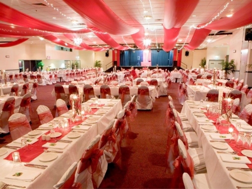 Marquee ceiling canopy white silks, purple bows long tables - Cex