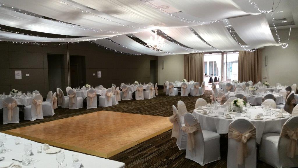 Marquee ceiling canopy chair covers white champagne bows Pacific Bay Resort