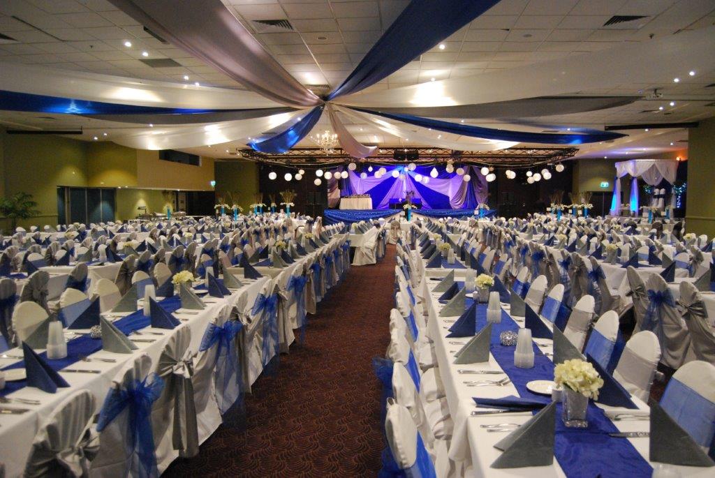 Star ceiling canopy royal blue bows long tables  - Grand Auditorium Cex