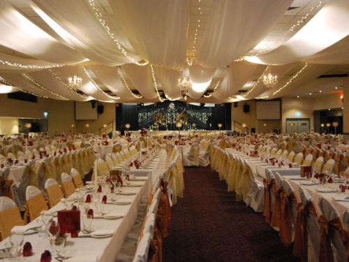 Marquee ceiling canopy white silks, lemon organza bows long tables - Cex