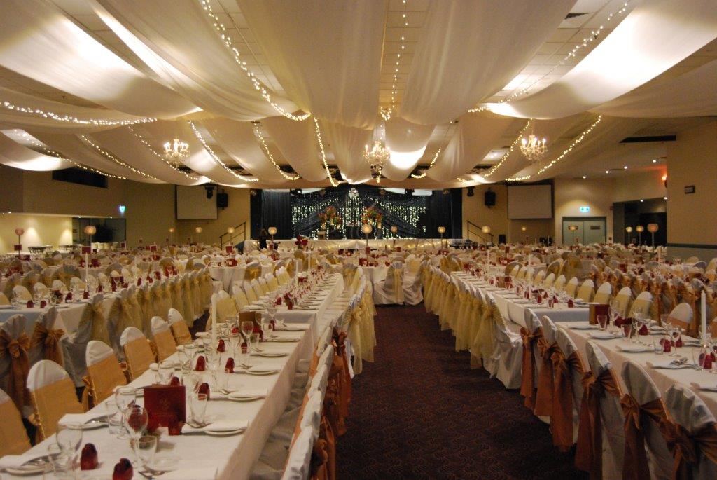 Marquee ceiling canopy white silks, lemon organza bows long tables - Cex