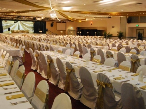 Star ceiling canopy gold bows long tables  - Grand Auditorium Cex