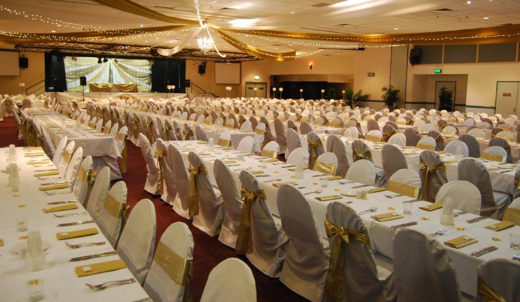 Star ceiling canopy gold bows long tables  - Grand Auditorium Cex