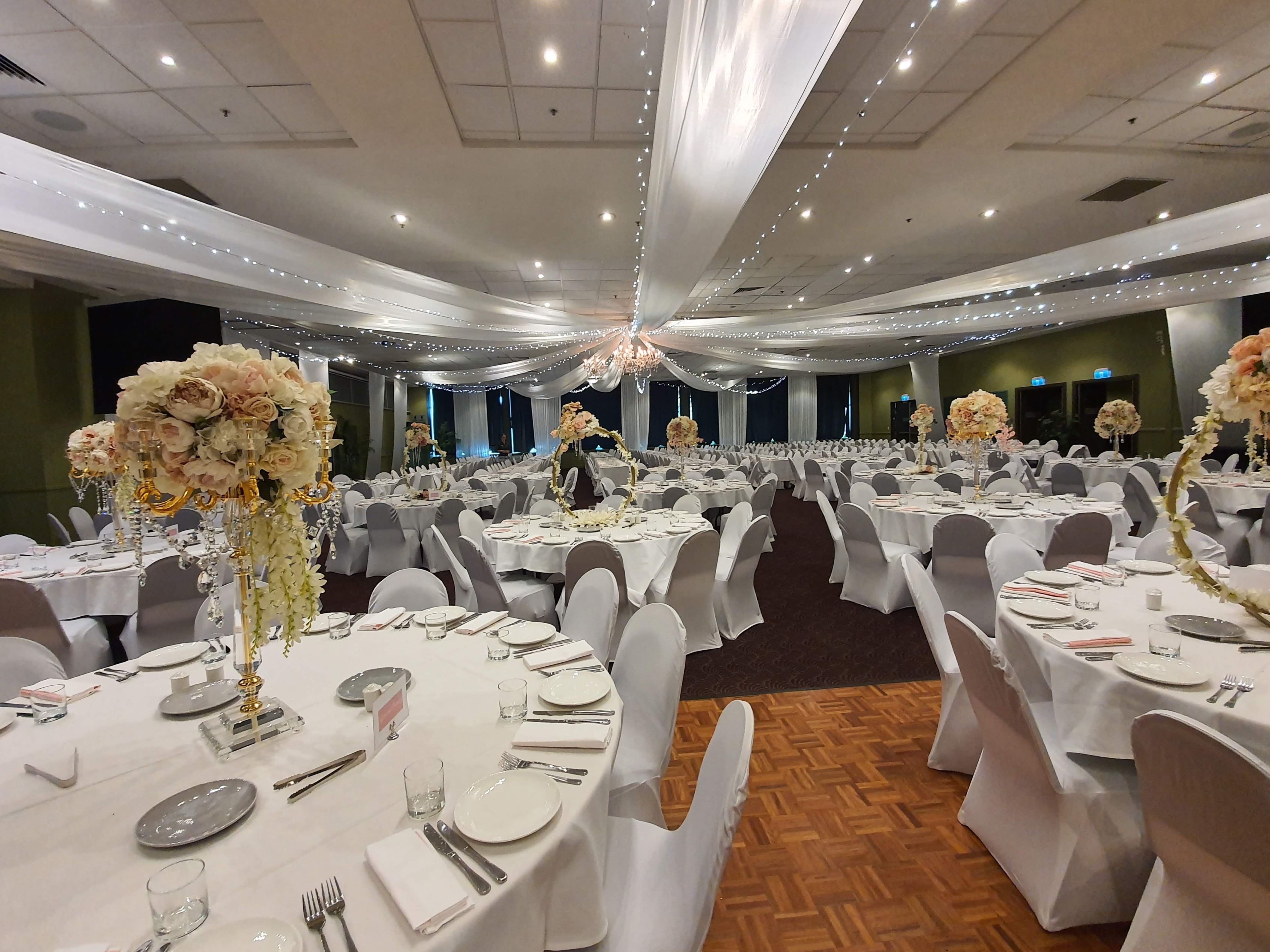 Star ceiling canopy white & fairy lights, crystal chandeliers, white chair covers