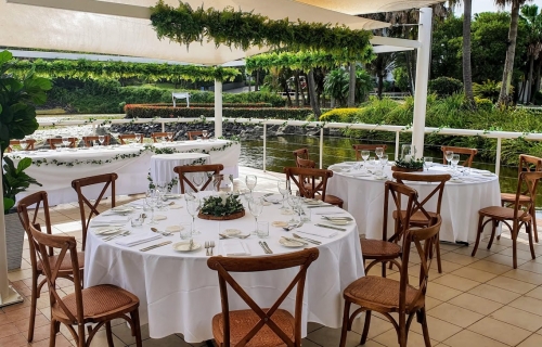Bay side grill, Brown Hampton chairs , greenery branches  - Pacific Bay Resort