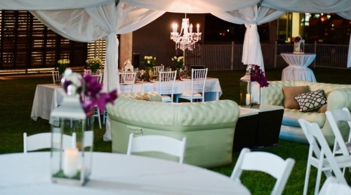 Marquee chandeliers, chesterfield lounges, white Tiffany & Malibu chairs