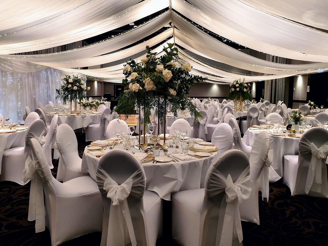 Marquee ceiling canopy gold towers white bows