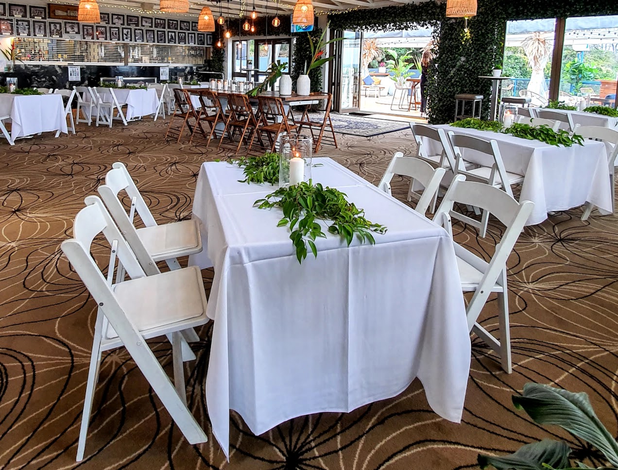 Cocktail style wedding reception backdrop greenery door framing, 6 x mall venue tables, Malibu chairs