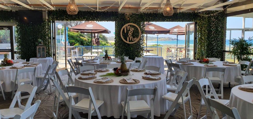 Backdrop 3 Forest Greenery Door Framing , Malibu chairs, Pineapple table decoration, MR & MRS Sign