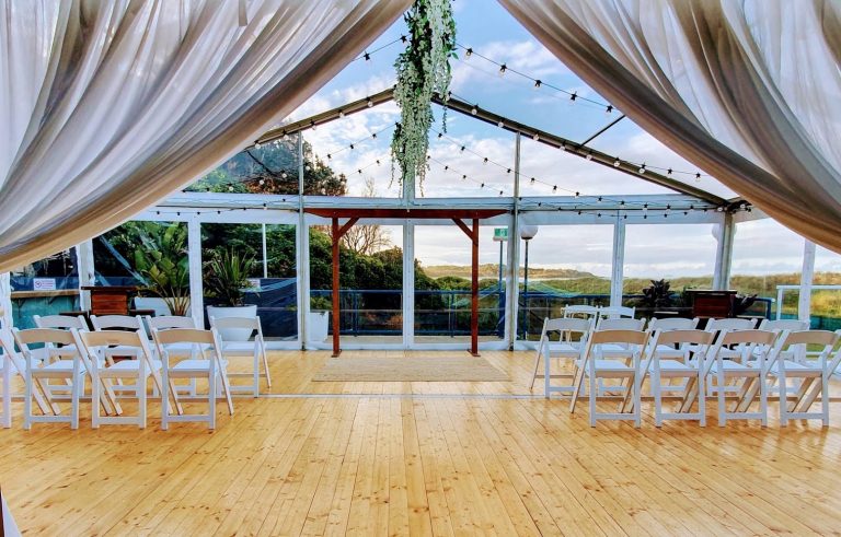 Festoon lighting, Wisteria green ceiling bar, Timber arbour, White Malibu Chairs,