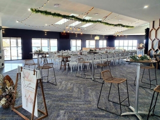 Woolgoolga surf  Hi dry bars , rattan stools, ceiling canopy, fern greenery ,festoon lighting. Edison chandeliers