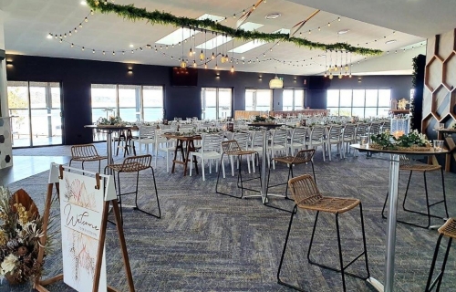 Woolgoolga surf  Hi dry bars , rattan stools, ceiling canopy, fern greenery ,festoon lighting. Edison chandeliers