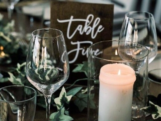Woolgoolga surf  table décor ivy string, timber table numbers white writing, glass cylinder vase + fresh pillar candle, timber topper tables