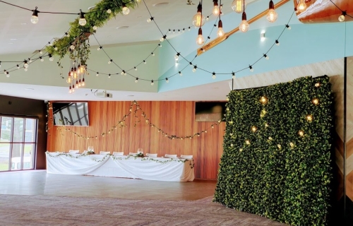 Woolgoolga surf ceiling festoon, bridal table, photo booth greenery